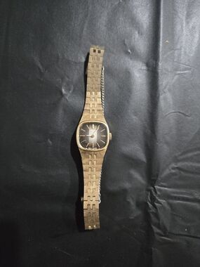 Seiko Gold Tone Ladies Analog Bracelet Watch with Black Dial
